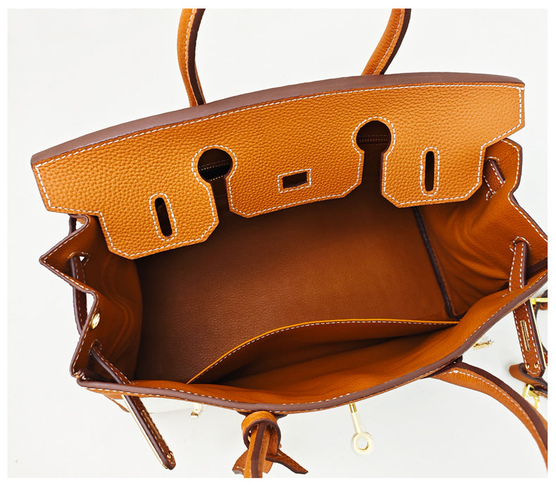 Top Handle Bag in Pebbled Grain Leather & Canvas with Gold-Tone Twist Lock detail image 4