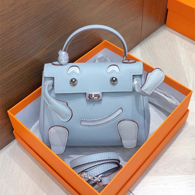 Smile Doll Bag Genuine Leather Mini Handbag with Top Handle and Crossbody Strap detail image 9