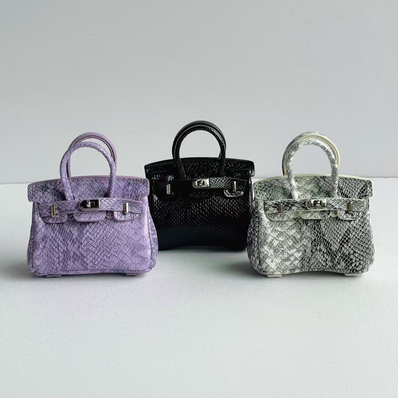 Mini Top Handle Bag Charm with Snakeskin Texture – PU Leather Keychain & Earphone Case product image 1