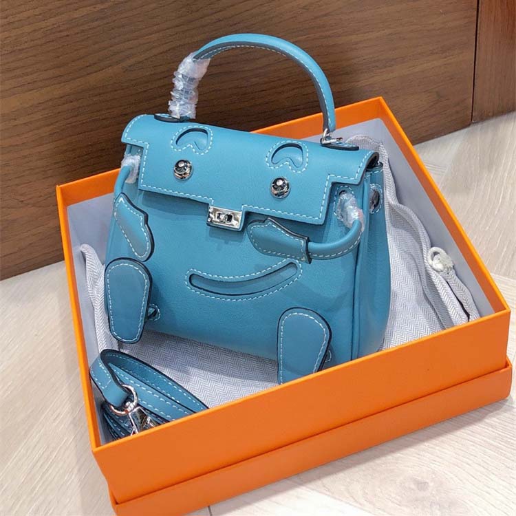Smile Doll Bag Genuine Leather Mini Handbag with Top Handle and Crossbody Strap detail image 13