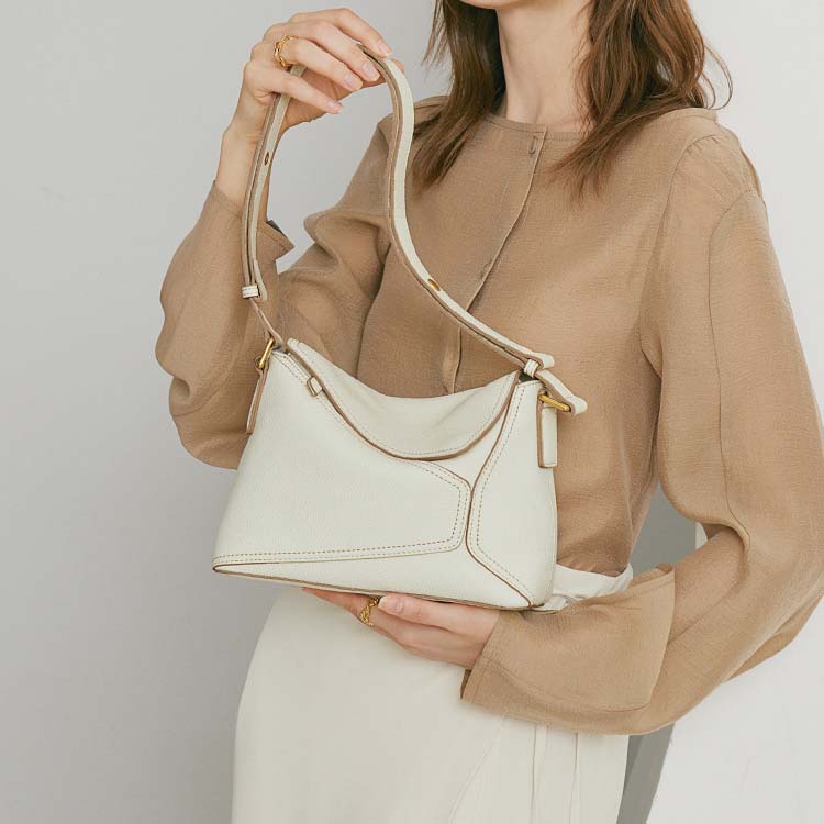 Geometric Dumpling Leather Crossbody Bag with Adjustable Strap detail image 11